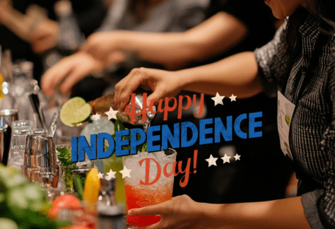 "An interactive Independence Day cocktail class at 786 Bartend, The Bartenders Institute in Miami, with participants crafting patriotic and historical drinks led by an expert instructor."