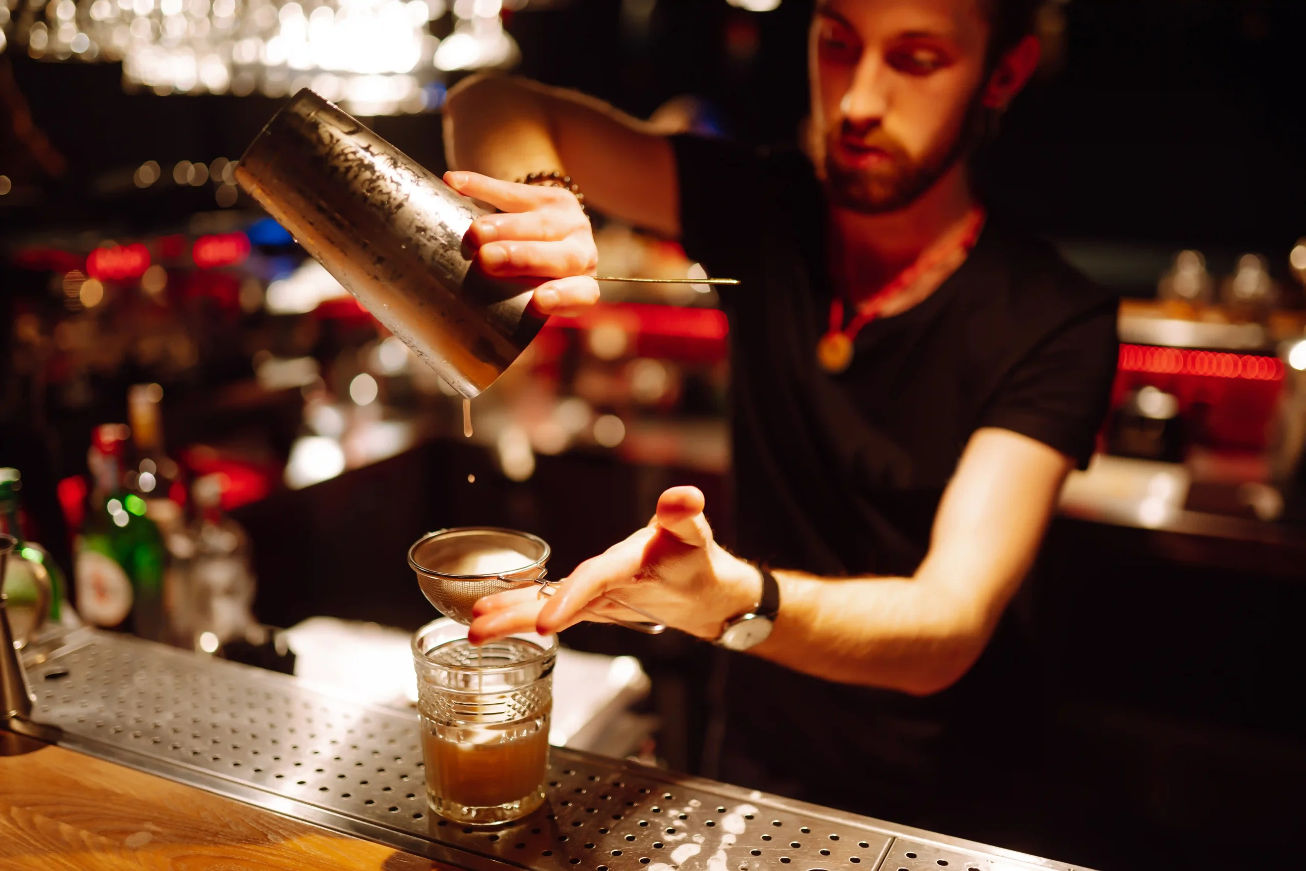 Bartender preparing cocktails behind a bar in Florida