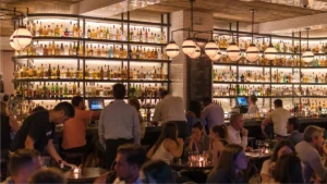 Busy South Florida bar with patrons illustrating bartending career opportunities in Florida